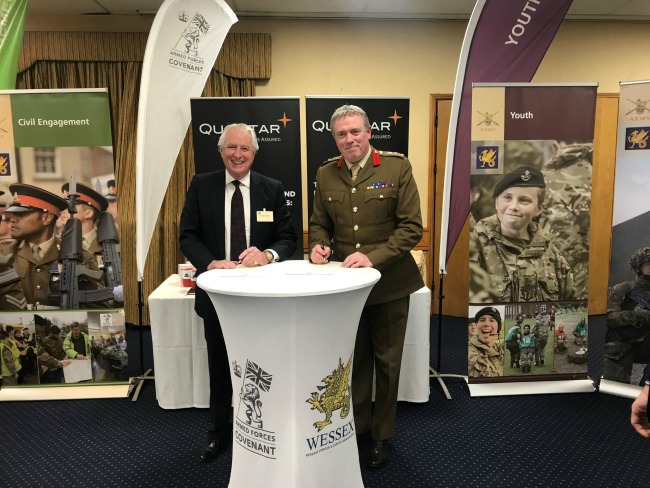 QuoStar Chairman John Knowles signing the Armed Forces Covenant